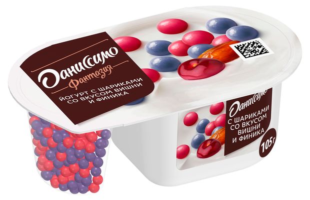 Йогурт Даниссимо Фантазия хрустящие злаковые шарики в белой шоколадной глазури со вкусом вишни и финика 6.9% БЗМЖ, 105 г